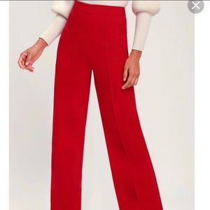 Wide-leg navy blue trousers.